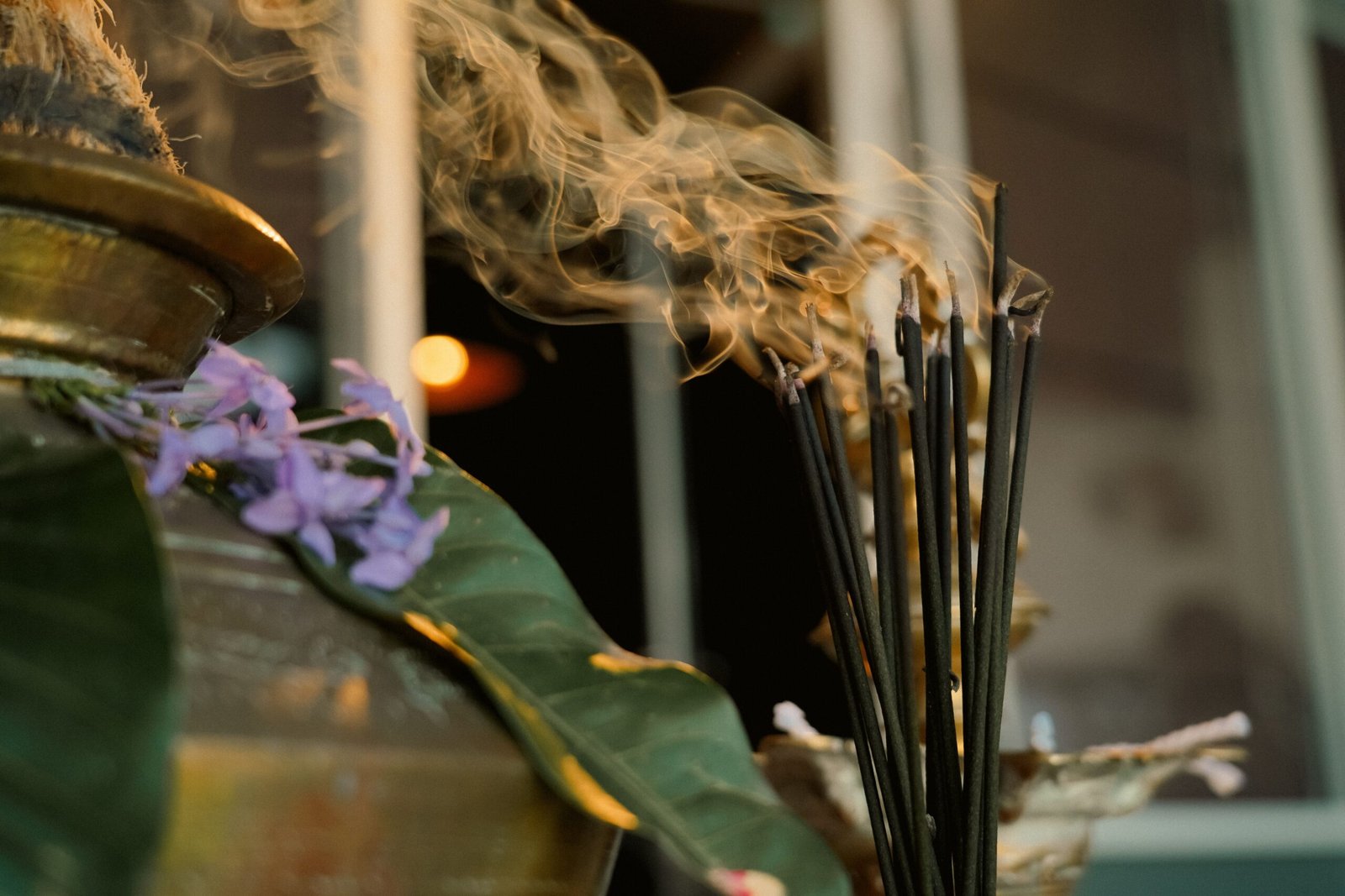 Smoke rising from incense sticks placed near a traditional Pongal festival setup in Sri Lanka.